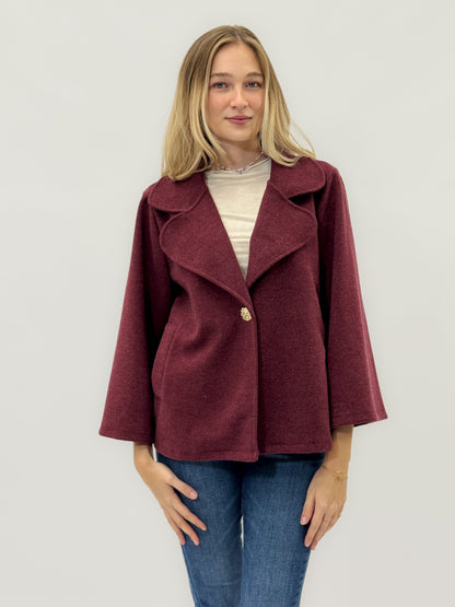 Veste avec bouton bijou