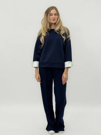 Ensemble en tissu technique avec sweat à capuche oversize et pantalon palazzo