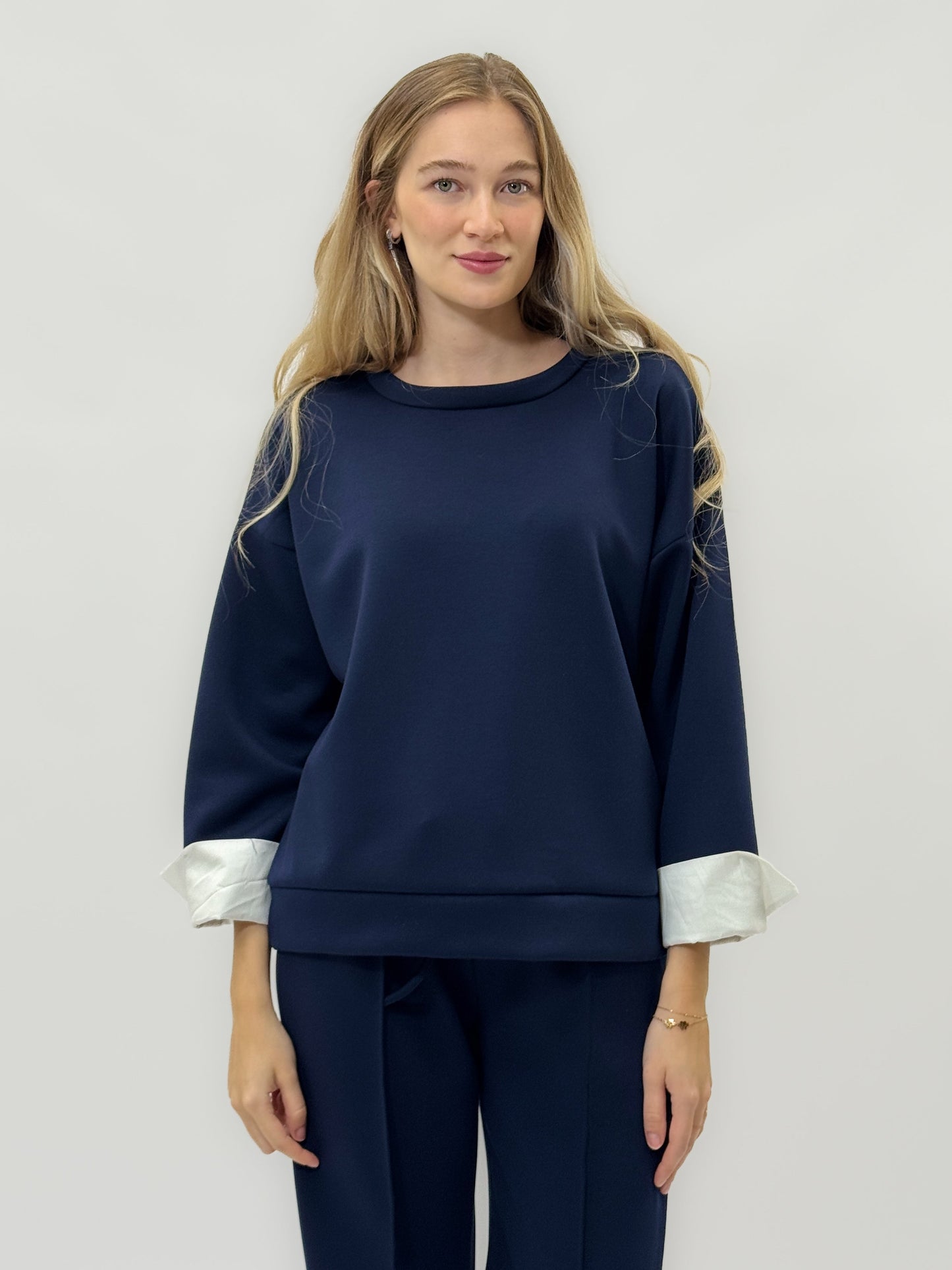 Ensemble en tissu technique avec sweat à capuche oversize et pantalon palazzo