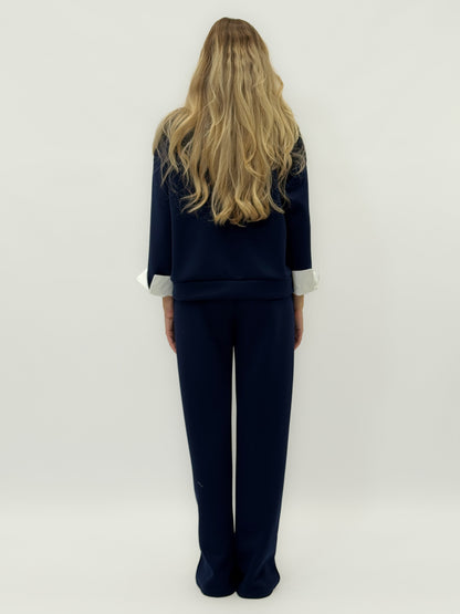 Ensemble en tissu technique avec sweat à capuche oversize et pantalon palazzo