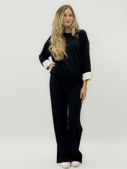 Ensemble en tissu technique avec sweat à capuche oversize et pantalon palazzo